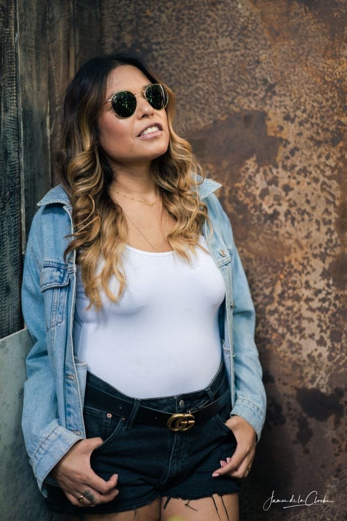 Girl in Ray Ban glasses and denim shirt